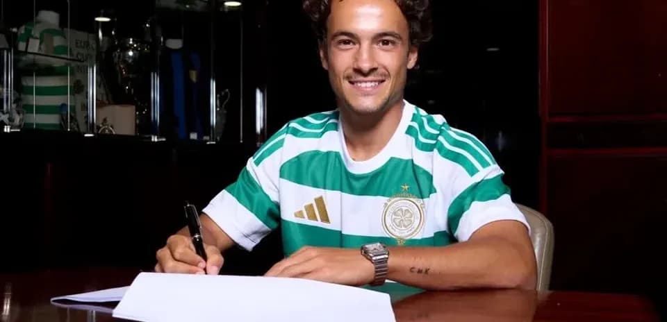 Player signing contract while wearing team jersey