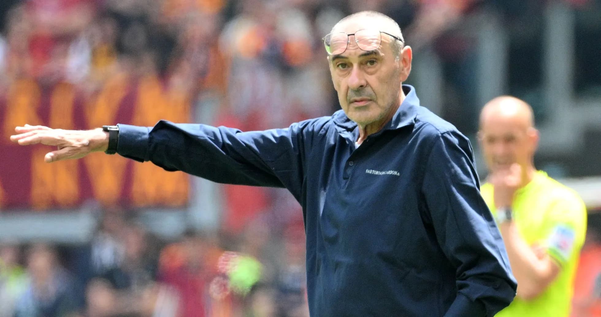 Coach gesturing during a match on the sidelines