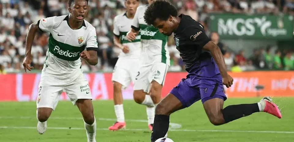 Player dribbling the ball during competitive match