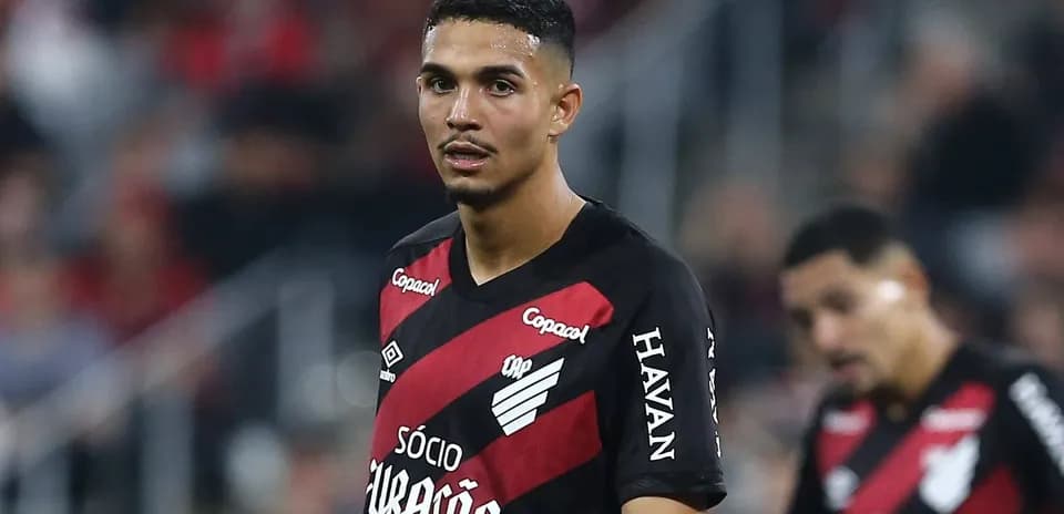 Player in red and black jersey on field