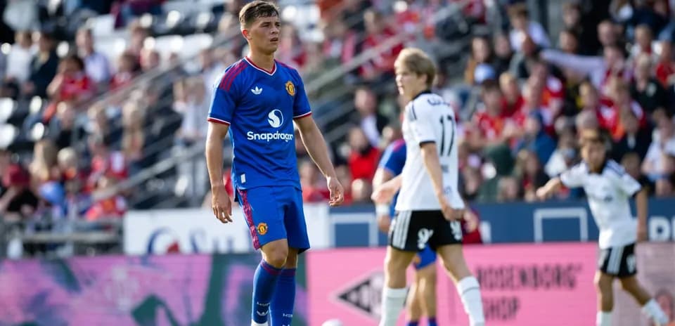 Player in blue Manchester United kit on field