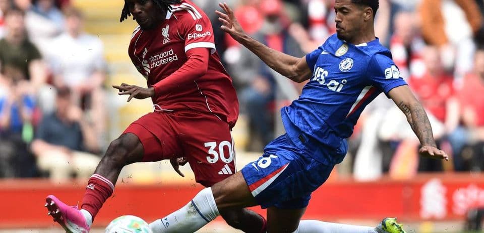 Two players contesting for the ball during match