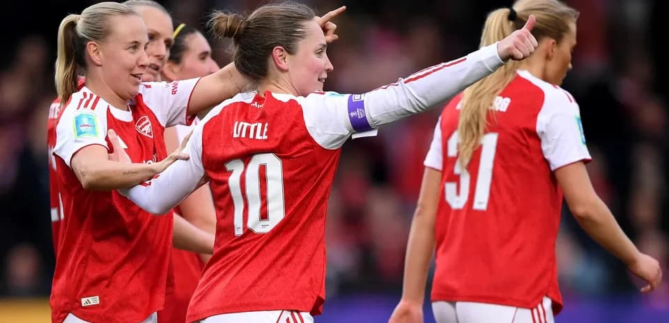 Arsenal W players celebrating during match