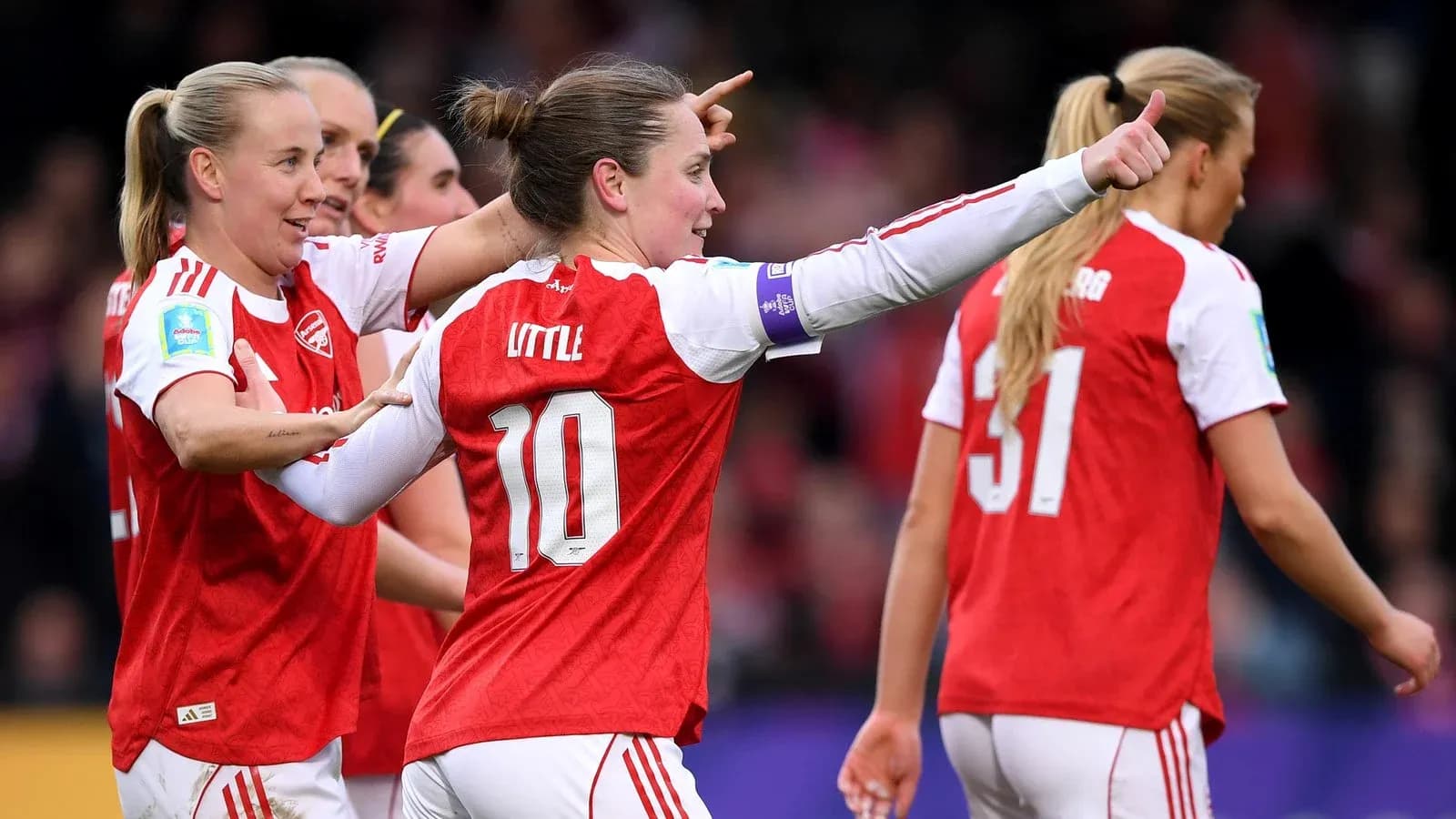 Arsenal W players celebrating during match