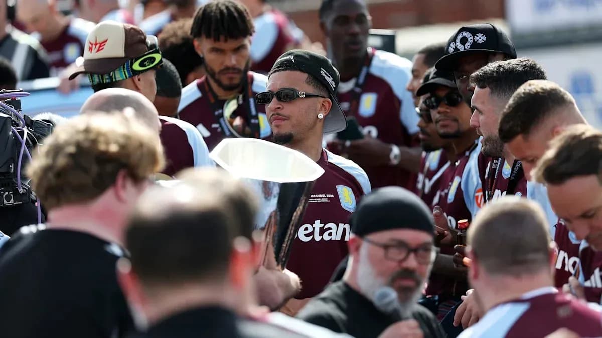 Aston Villa players gathered with a trophy