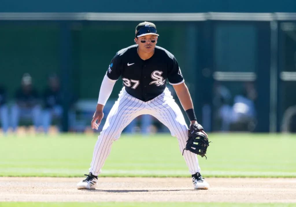 Baseball player in fielding position during game