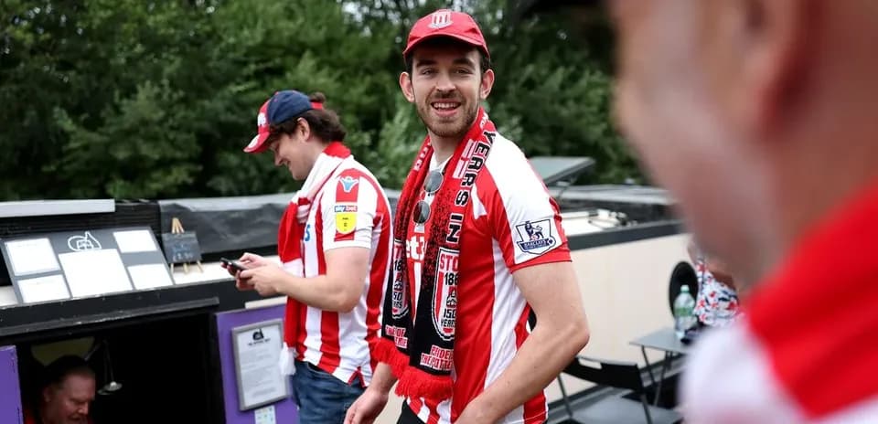 Fans wearing Stoke City jerseys at event