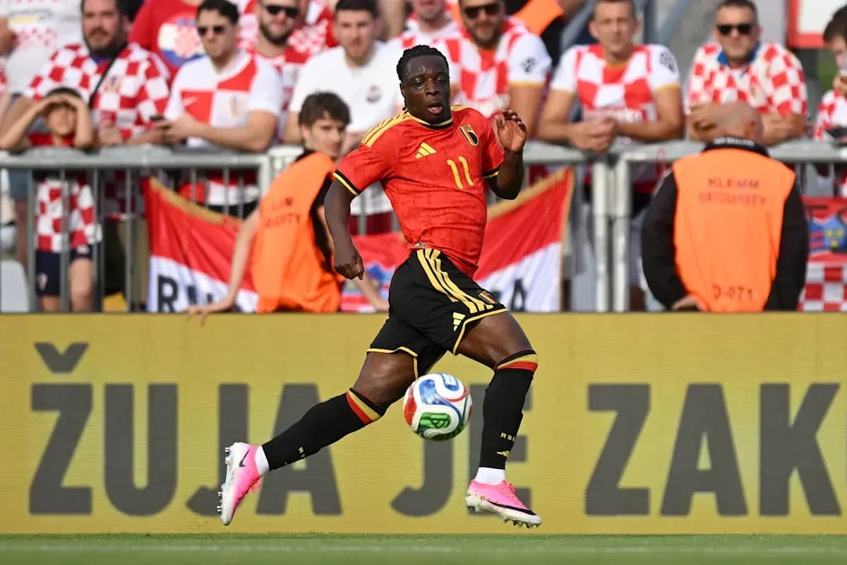 Belgian player running with the ball during match Belgian player running with the ball during match