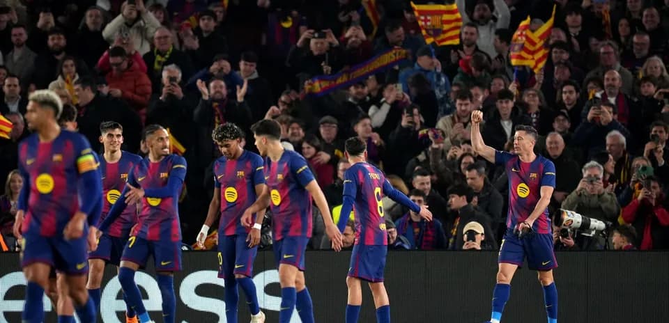 Barcelona players celebrating with fans in stadium