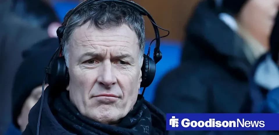 Man wearing headphones at a sports event