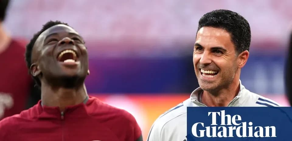 Player and manager smiling during training session