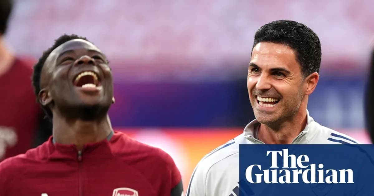 Player and manager smiling during training session