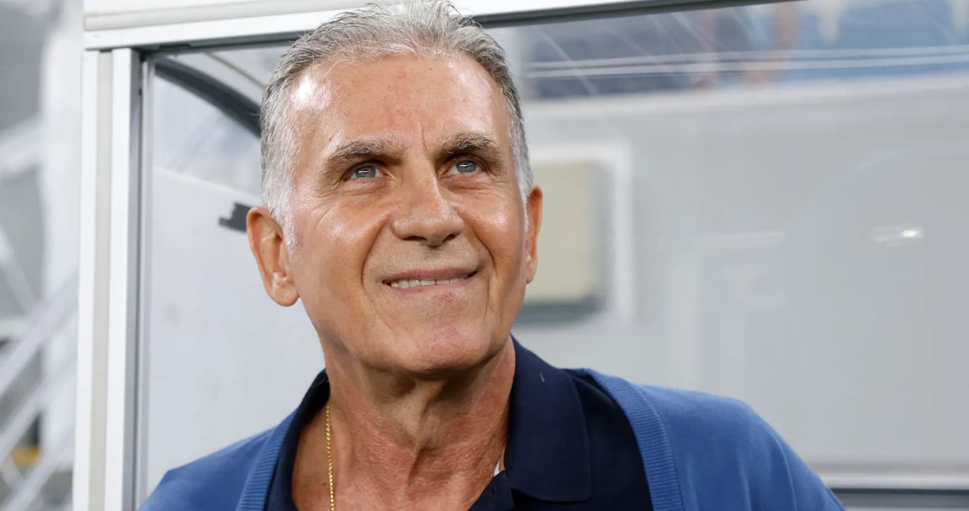 Coach smiling in a press box area