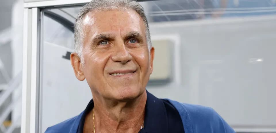 Coach smiling in a press box area