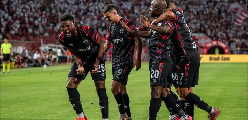 Players celebrating goal during UEFA Champions League match