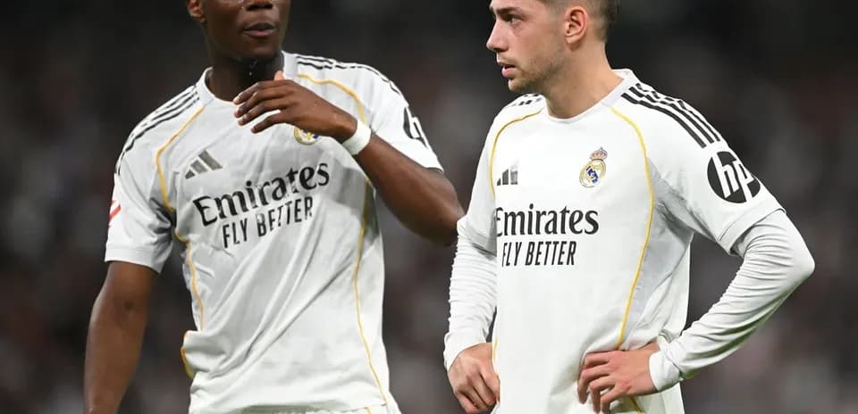 Two Real Madrid players discussing on the pitch