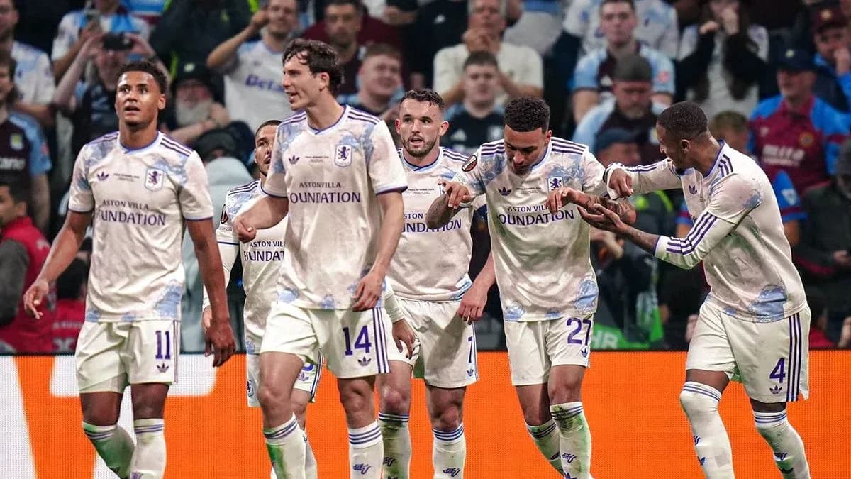 Aston Villa players celebrating a goal on the pitch