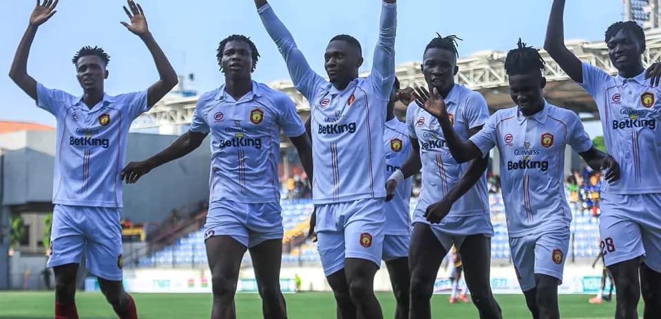 Players celebrating after scoring a goal