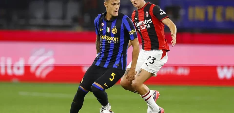 Two players contesting the ball during match