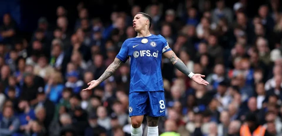 Player in blue Chelsea kit reacting during match