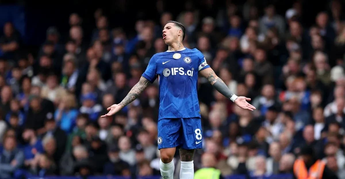 Player in blue Chelsea kit reacting during match