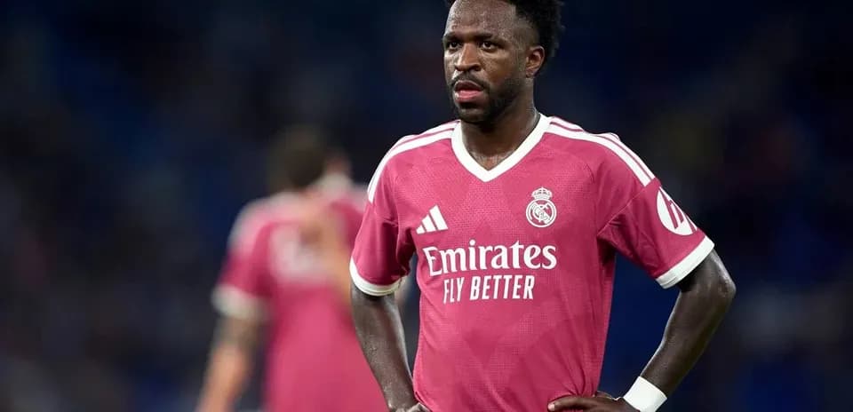 Player in pink Real Madrid jersey on the field