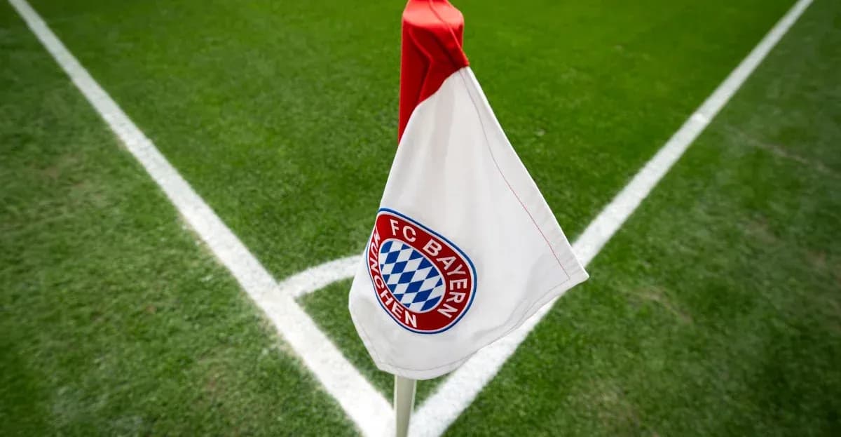 Corner flag with FC Bayern München logo on pitch