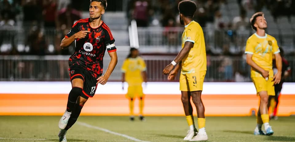 New Mexico United player celebrating a goal
