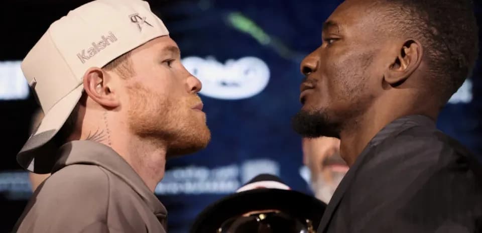 Two boxers facing off at pre-fight event