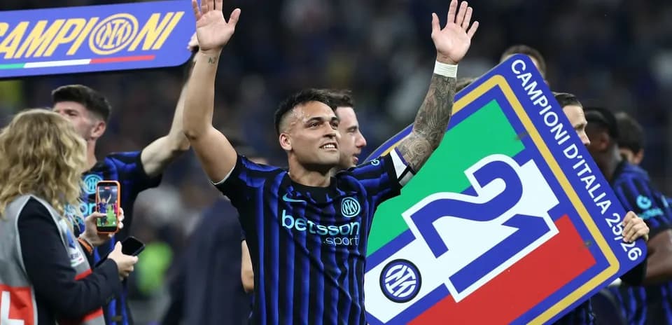 Player celebrating with championship banner after match