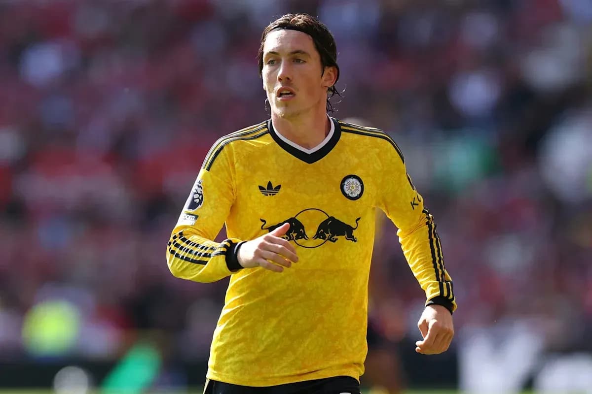 Player in yellow kit running on the field