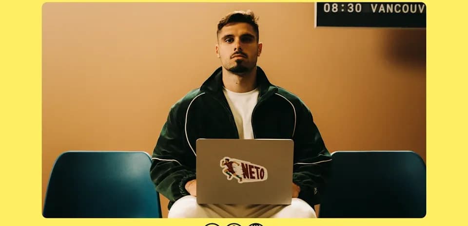 Man sitting with laptop, waiting in a room