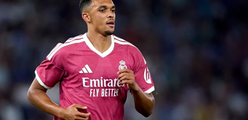 Player wearing pink Real Madrid jersey during match