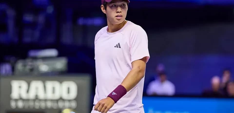 Tennis player in pink outfit during match