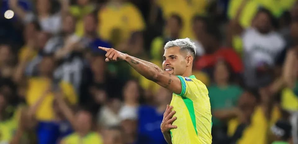 Player celebrating and pointing to crowd in stadium
