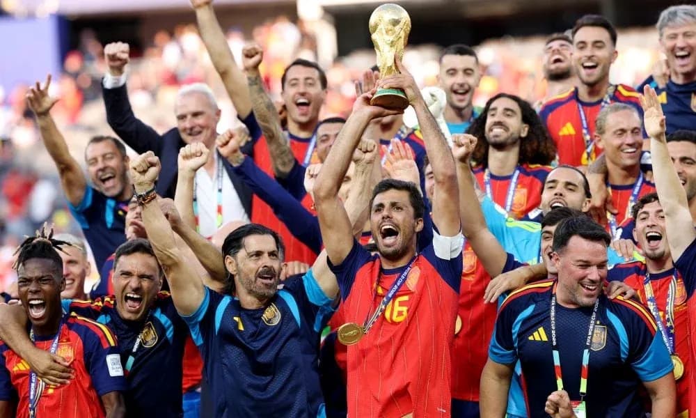 Spain team celebrating with World Cup trophy