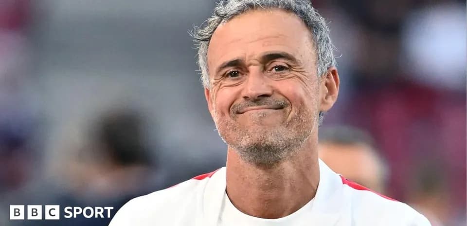 Coach smiling during post-match celebration