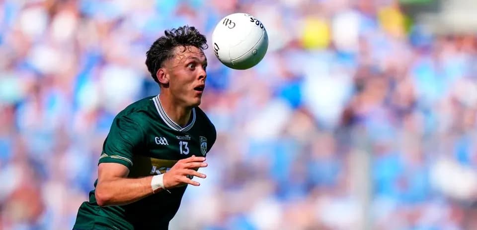 Player attempting to catch a football during match