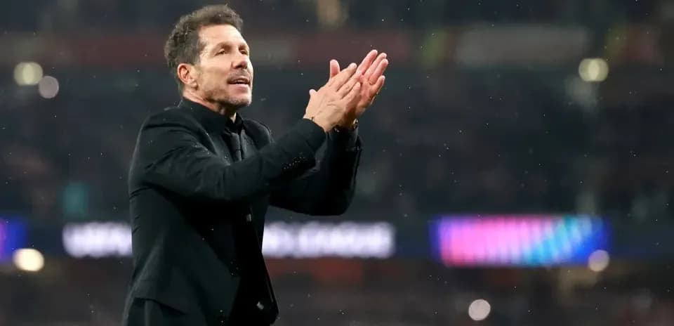 Manager applauding fans during match celebration