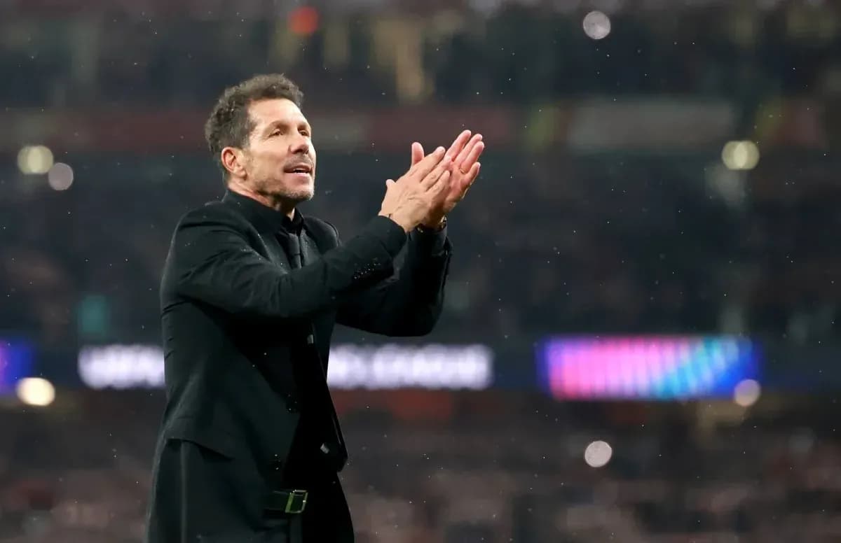 Manager applauding fans during match celebration