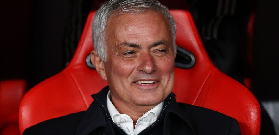 Coach sitting on bench during a match