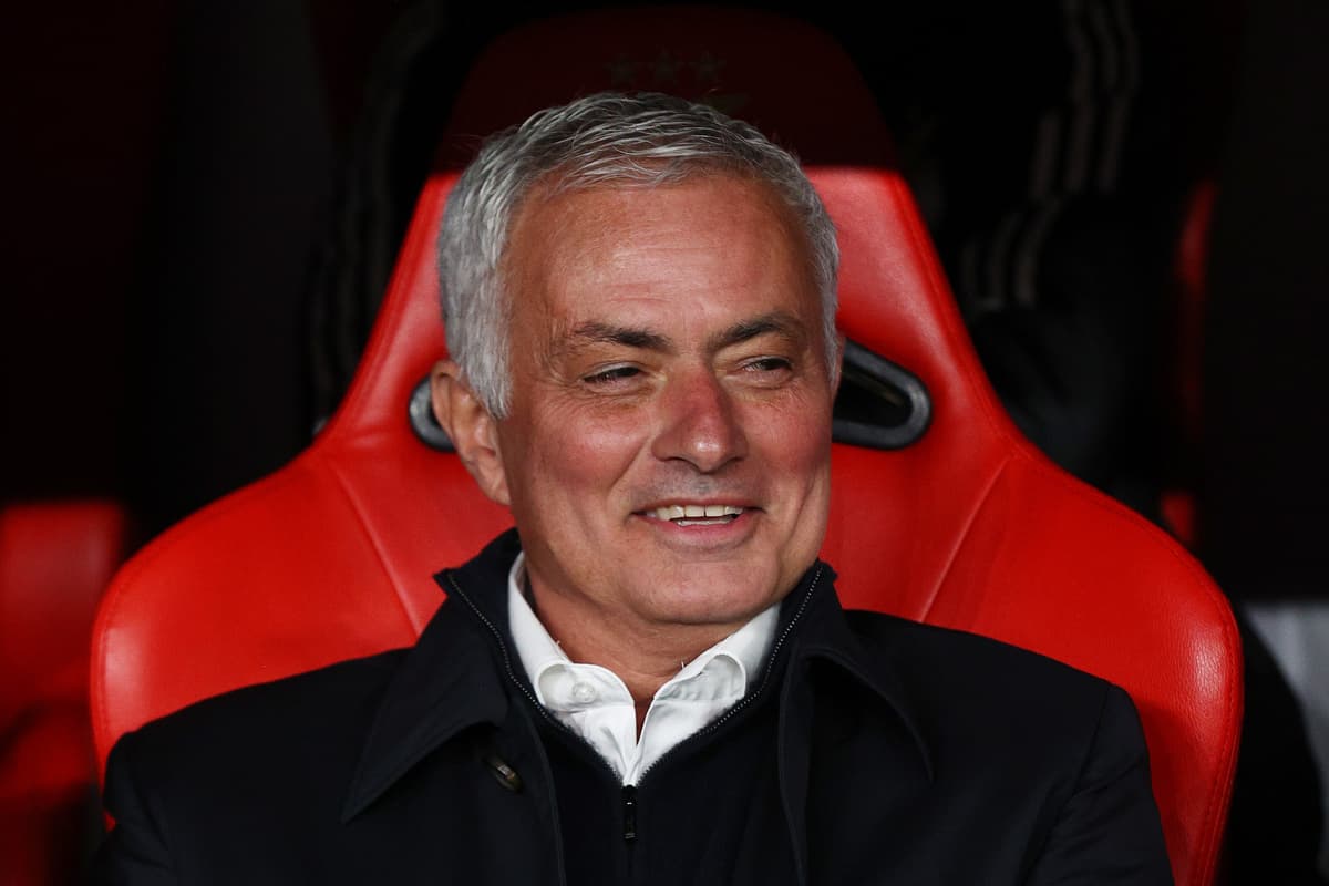Coach sitting on bench during a match
