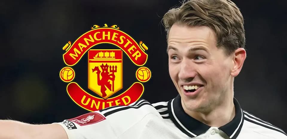 Player celebrating with Manchester United logo in background