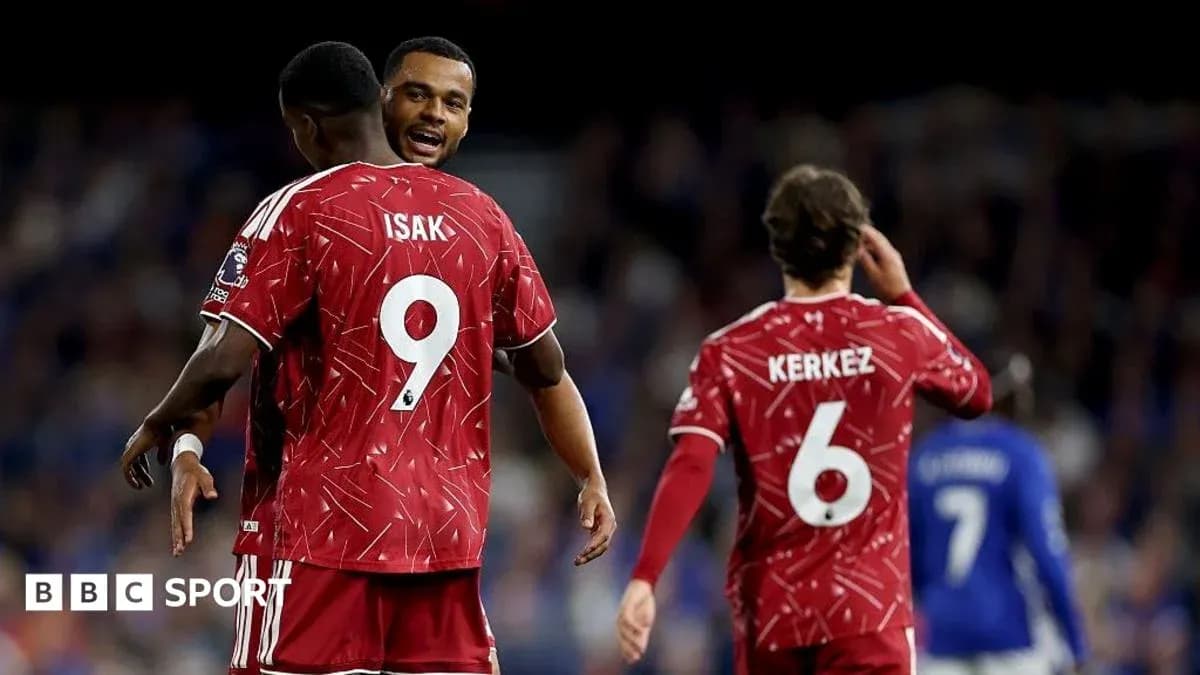 Players celebrating during a match with red jerseys