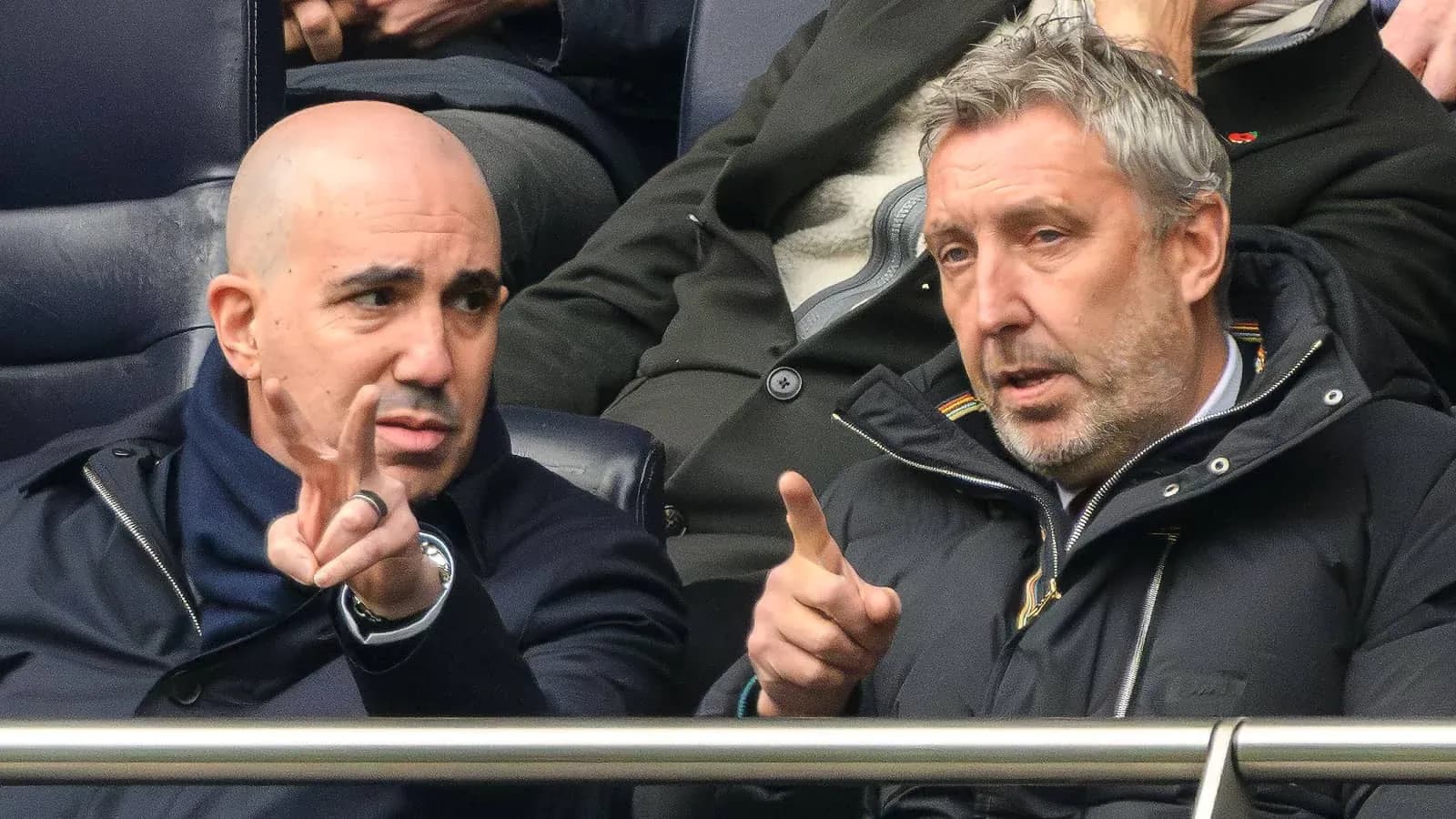 Two men discussing during a sports event