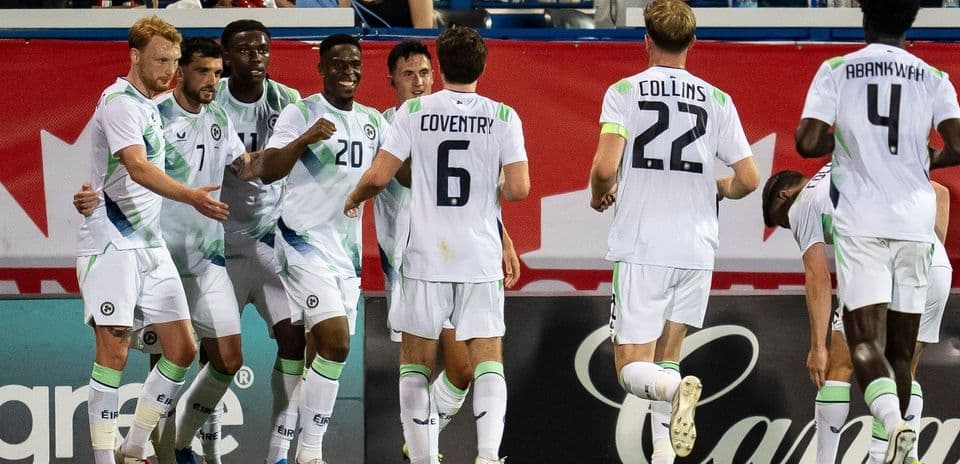 Players celebrating a goal during a soccer match