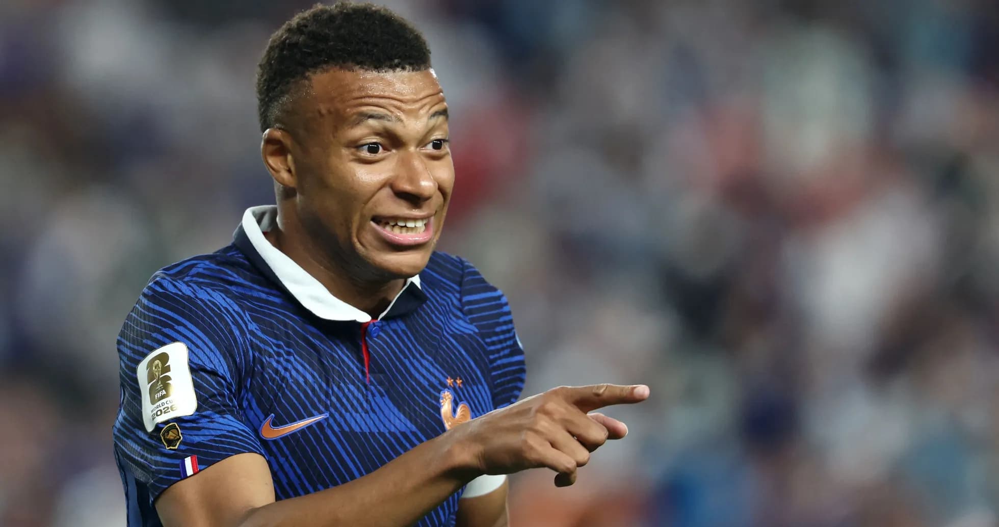 Kylian Mbappé gesturing during a football match