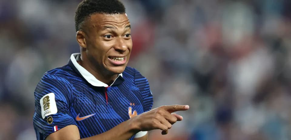 Kylian Mbappé gesturing during a football match