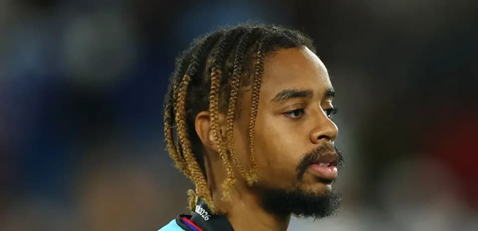 Player with braided hair during match warm-up