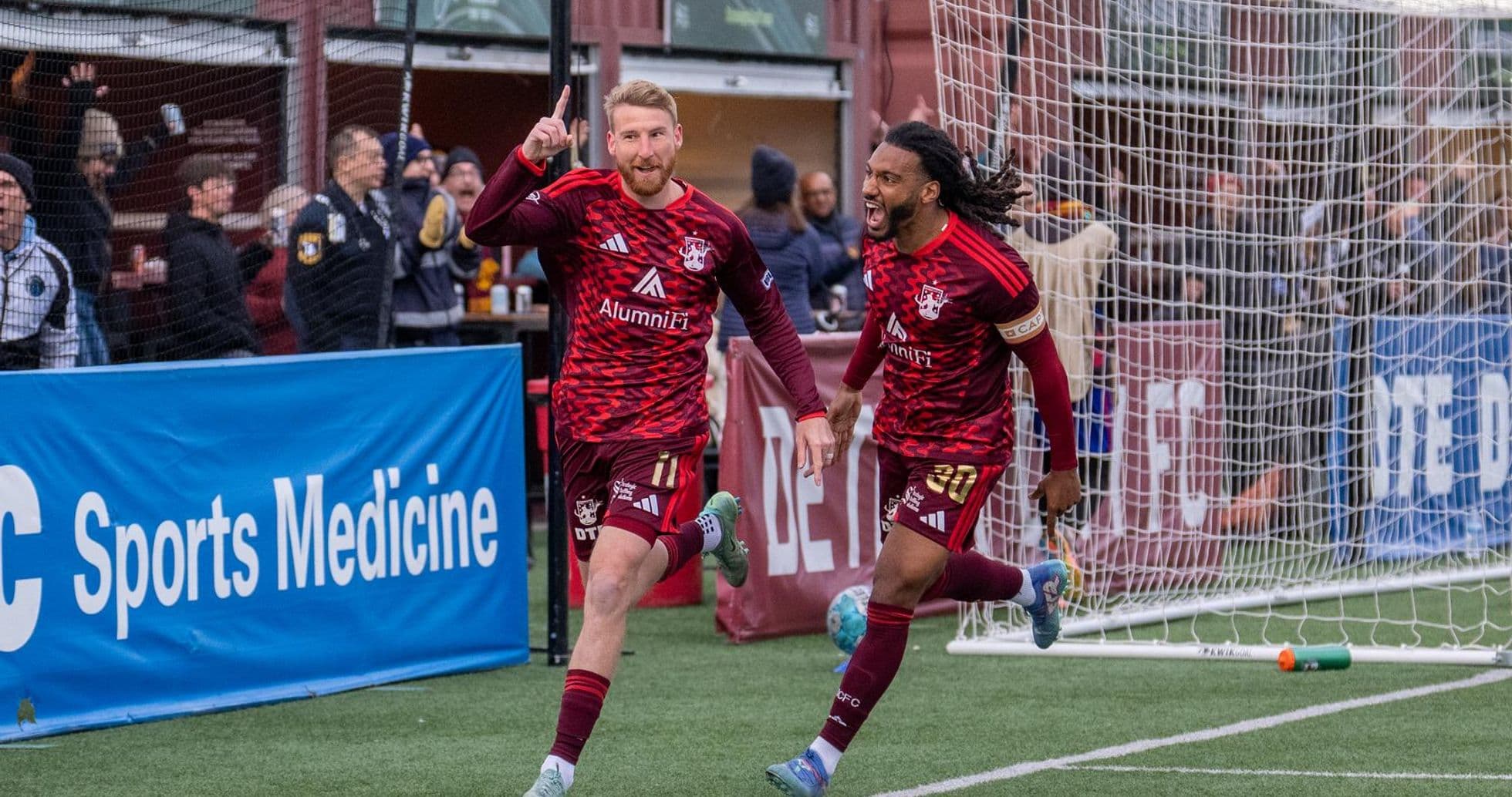 Detroit City players celebrating a goal
